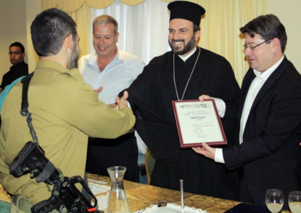 Father Naddaf with soldiers